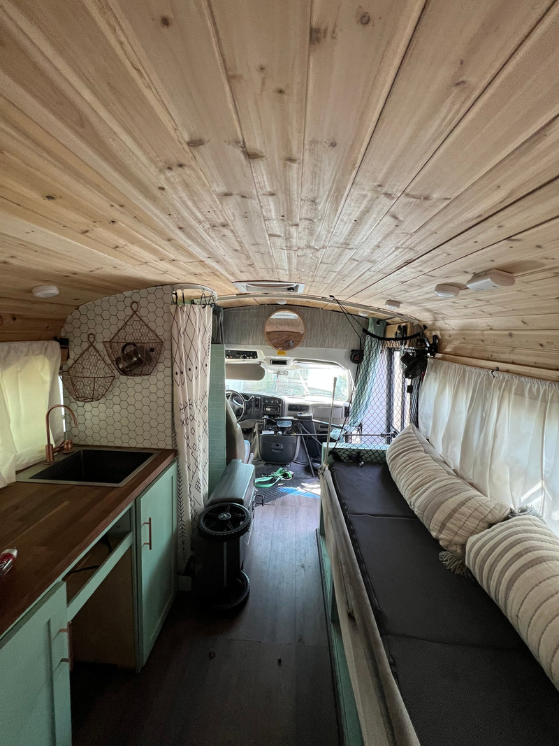  a light blue converted bus for RV rental — photo 13