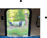 Enjoying the riverside view from our RV rental! Camping chairs are set up for a relaxing day in nature.
