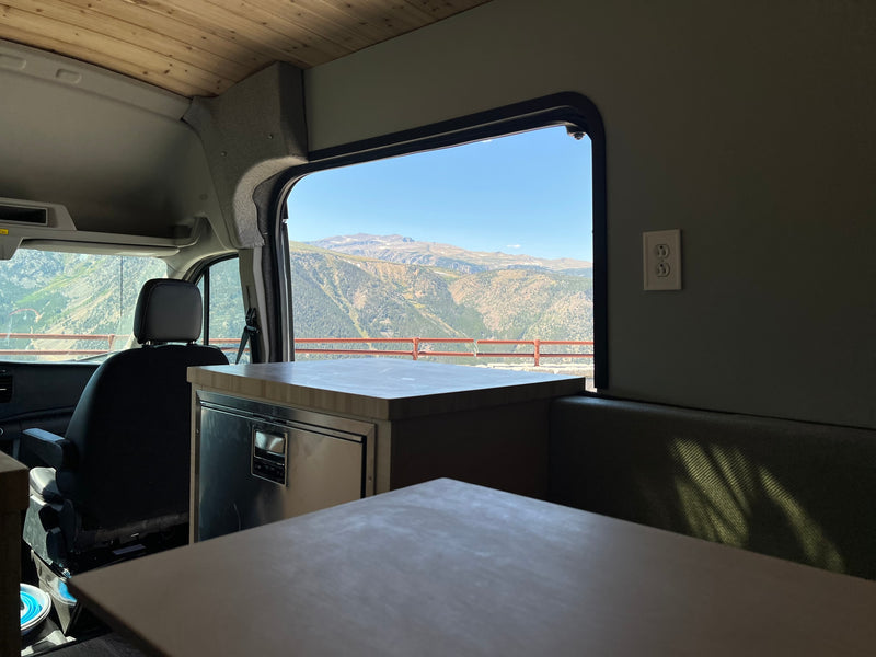  and front cabin seats.|Spacious and modern rv rental interior with custom wood features — photo 9