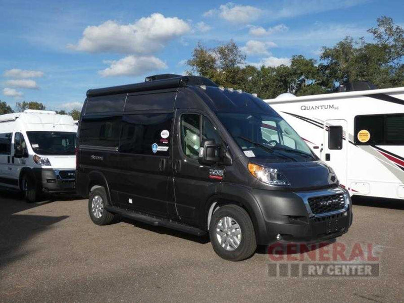 Dark gray ProMaster camper van, perfect for rv rental, is parked between a white van and a large RV. — photo 2