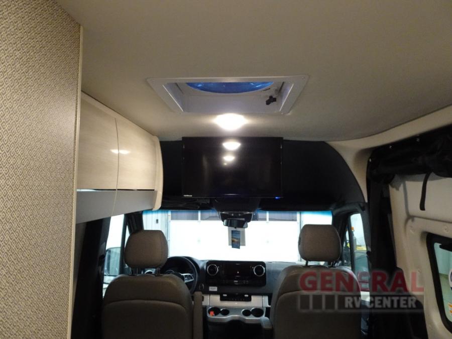  and rear lounge seating.|Step inside this rv rental! Features a modern kitchenette with sink — photo 7