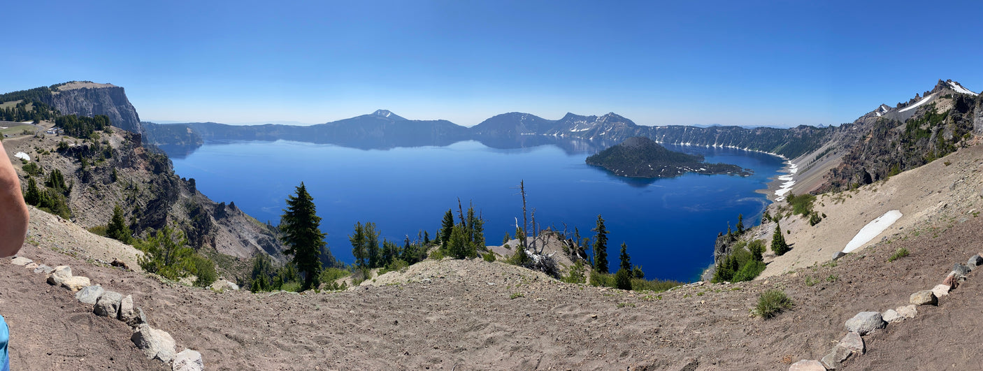 Vast Crater Lake panorama with Wizard Island under clear skies. An ideal RV rental trip for experiencing nature's grandeur and epic views.