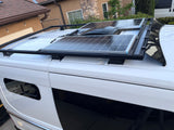 This white RV rental showcases two rooftop solar panels and a central vent system, ideal for off-grid adventures.