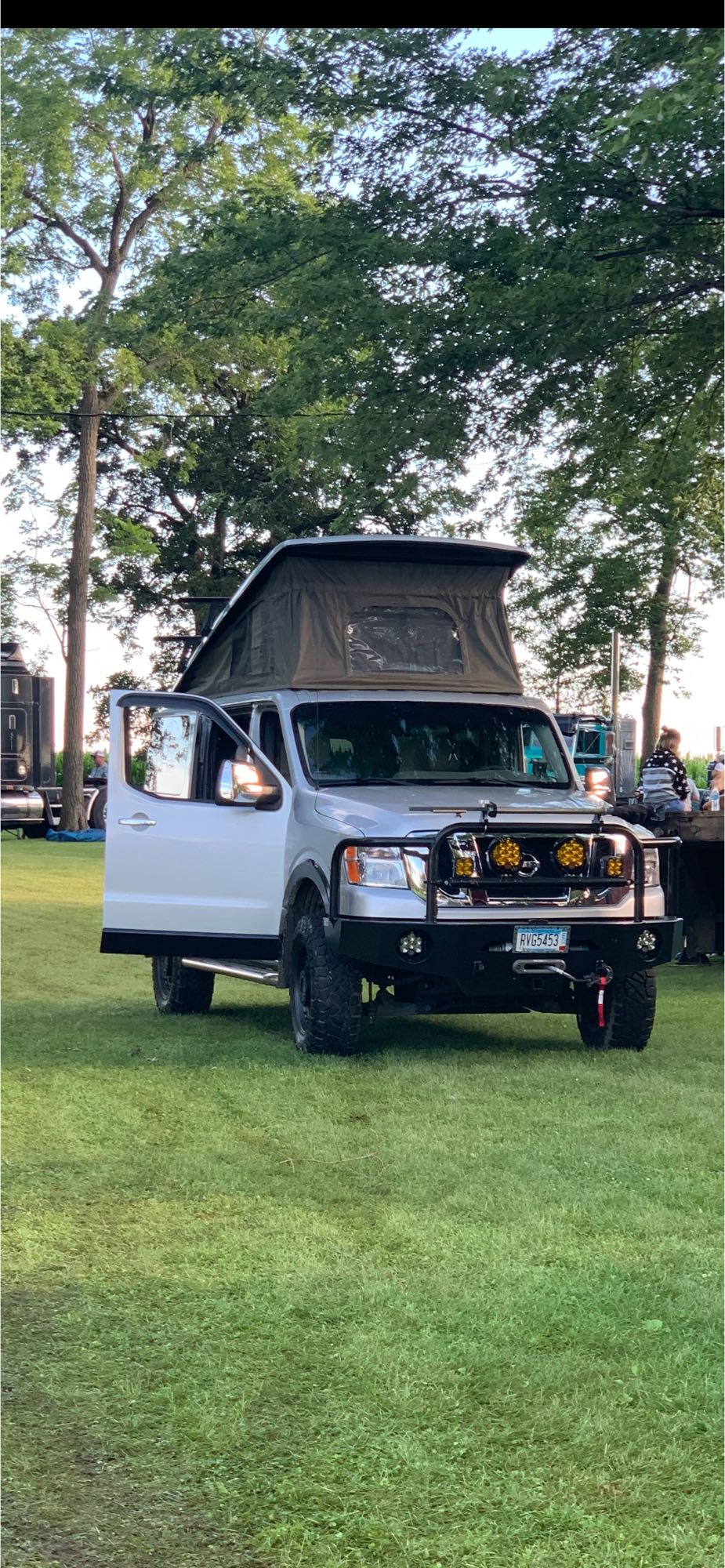 This custom silver Nissan NV van