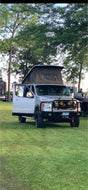 This custom silver Nissan NV van