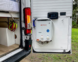 This RV rental's rear door is open, revealing a Camplux portable water heater, shower, and interior storage.