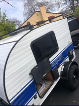 Compact Sunray Classic teardrop RV rental, featuring outdoor storage and rugged tires for adventure.