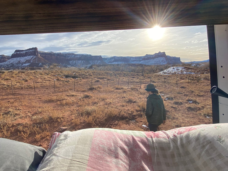  surrounded by snowy mountains.|RV rental views! A man in a Mountain Hardwear jacket enjoys coffee from his van — photo 4