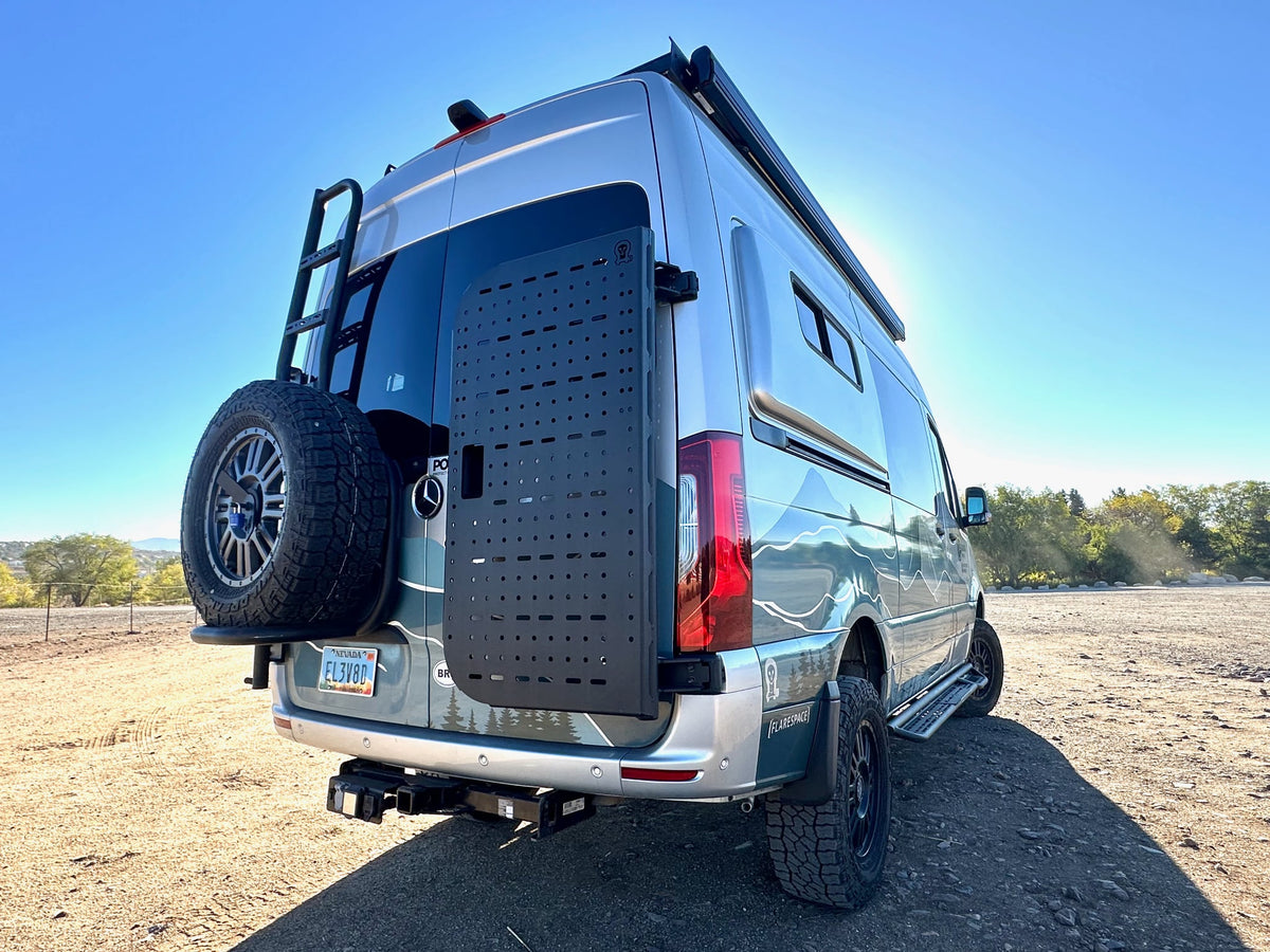  and smart overhead storage for your adventure.|RV rental: Cozy camper van interior showing a full kitchen — photo 10