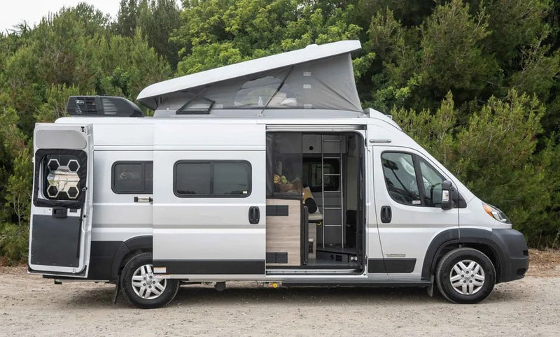 overlooking rugged cliffs and crashing ocean waves.|Enjoy a delightful breakfast inside this cozy RV rental! Comfy seats — photo 7