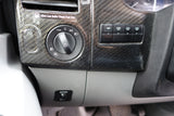 RV rental interior: Dashboard with light controls, auxiliary switches, diesel fuel reminder, and battery boost button.