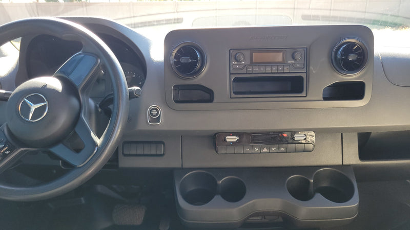  and a full kitchen.|White Mercedes-Benz Sprinter van conversion with a roof rack — photo 18