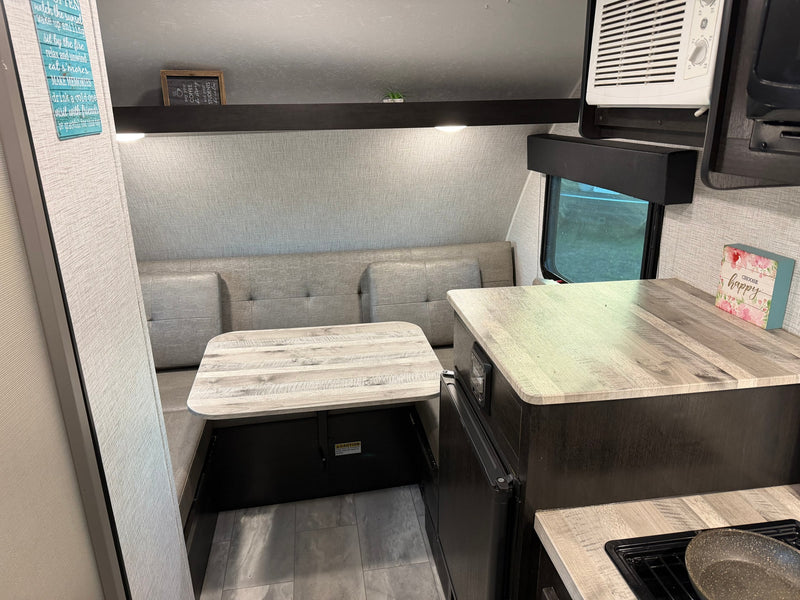  and a bunk. Ideal for road trips!|Compact RV rental bathroom with shower and toilet — photo 7