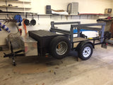 Custom gear trailer with multi-level racks & storage, ideal for active RV rental trips or hauling outdoor sports equipment.