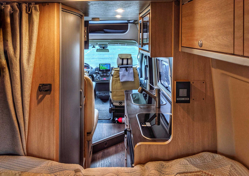  and a visible fire extinguisher.|Interior of an RV rental — photo 11