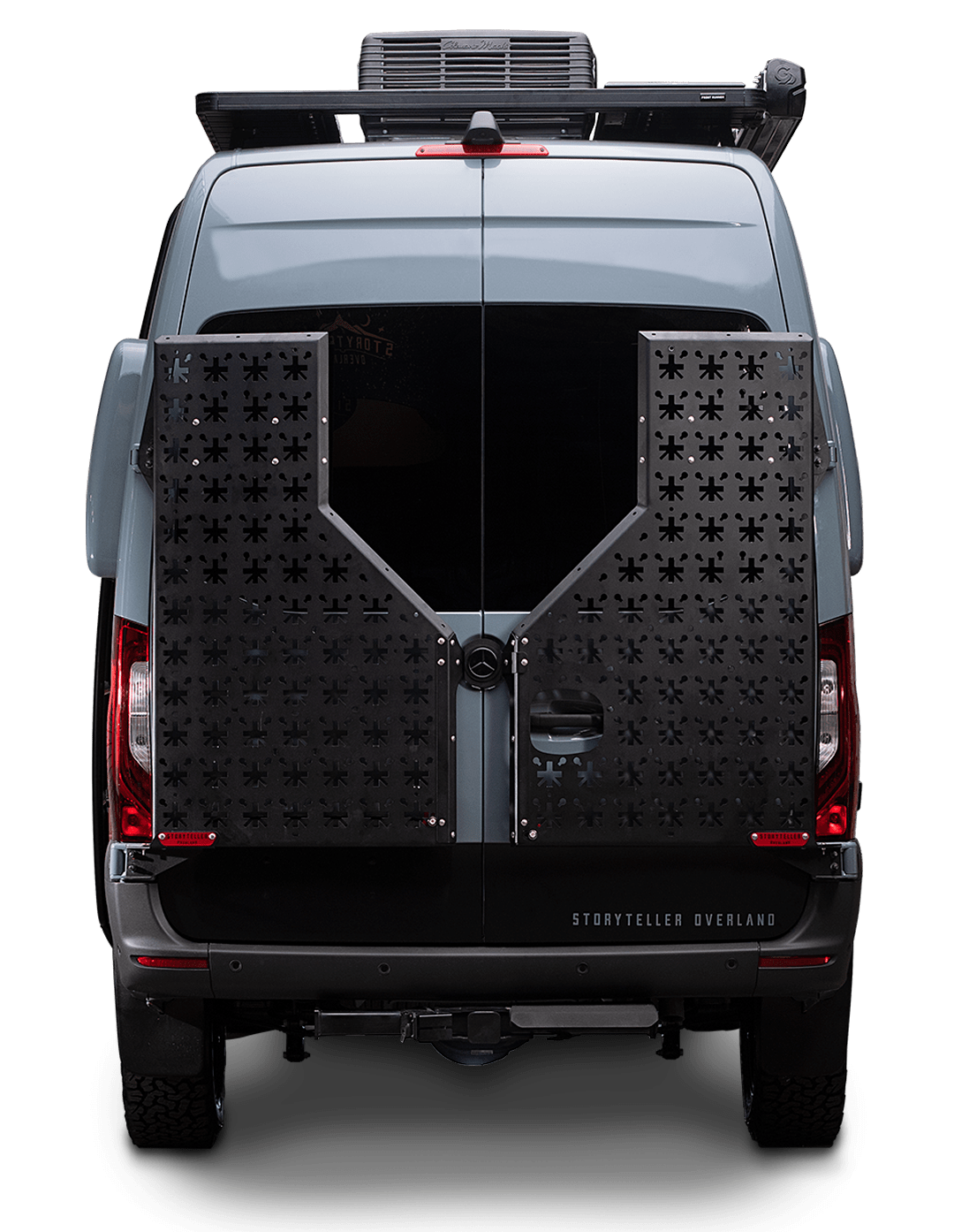 Rear view of a grey Storyteller Overland camper van, equipped for adventure, perfect for rv rental trips.