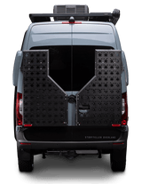 Rear view of a grey Storyteller Overland camper van, equipped for adventure, perfect for rv rental trips.