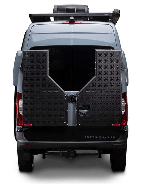 Rear view of a grey Storyteller Overland camper van, equipped for adventure, perfect for rv rental trips.