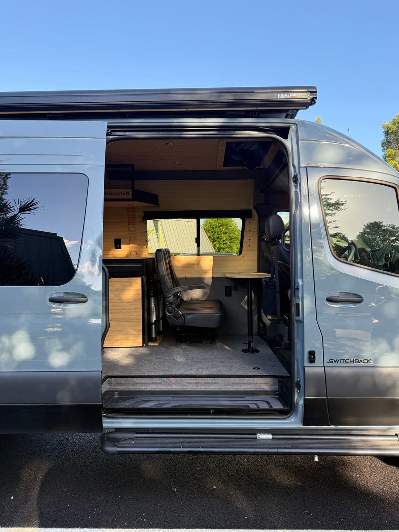  and overhead storage. Ready for adventure.|Modern custom RV rental interior by VANWORKS. Features a bamboo kitchen with sink — photo 13