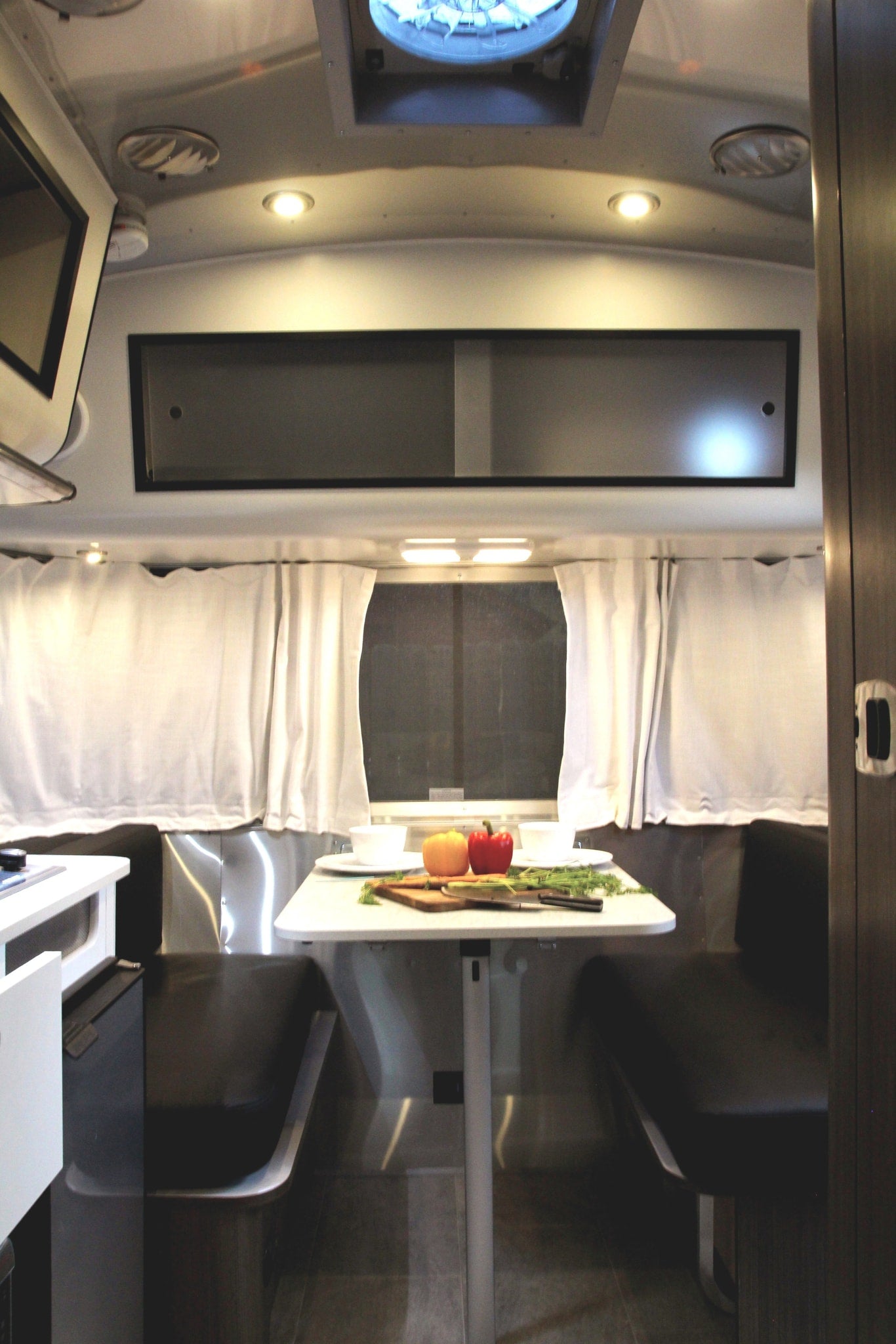  relax on soft blankets inside a cozy RV rental — photo 11