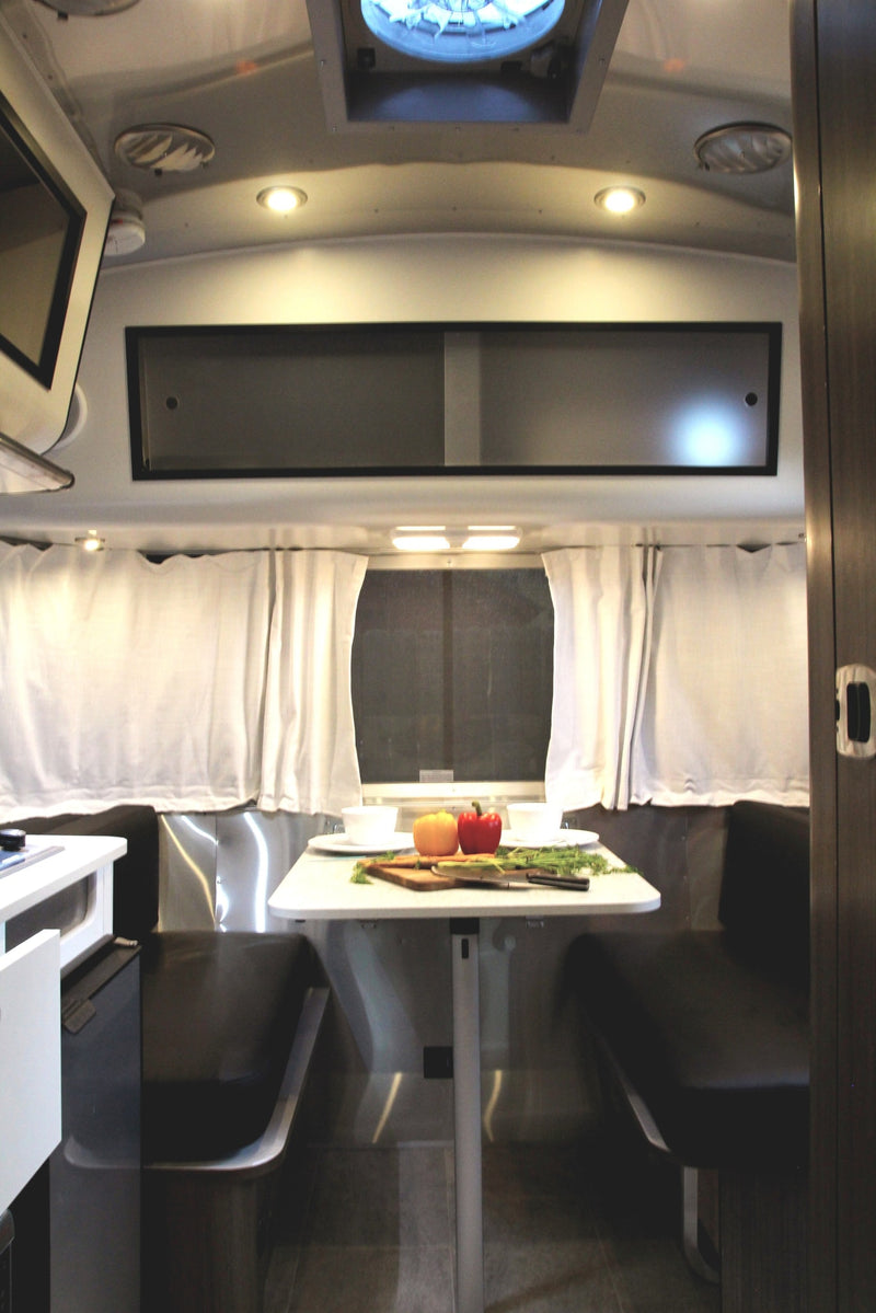  relax on soft blankets inside a cozy RV rental — photo 11