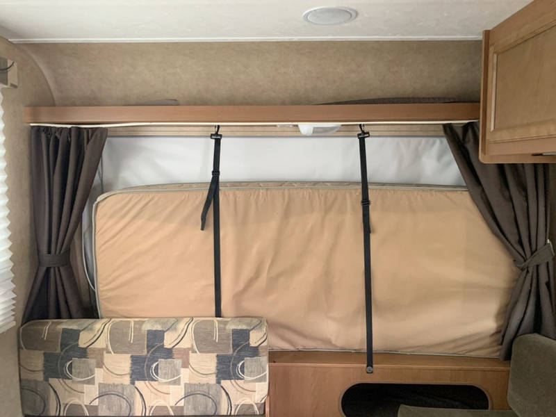  and overhead cabinets.|This RV rental features a compact kitchen with a two-burner stovetop — photo 15