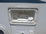 RV rental outdoor shower station with hot and cold water taps and hose, perfect for rinsing off on your camper.