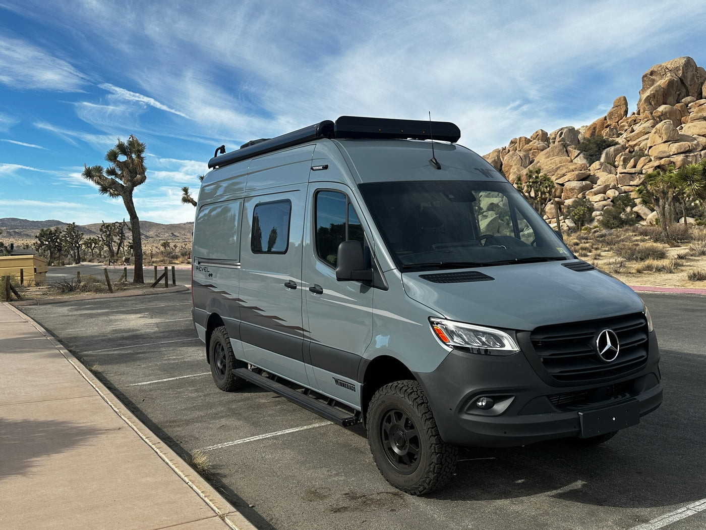 A sleek gray Winnebago Revel 4x4 Sprinter van, perfect rv rental for exploring desert parks like Joshua Tree. — photo 3