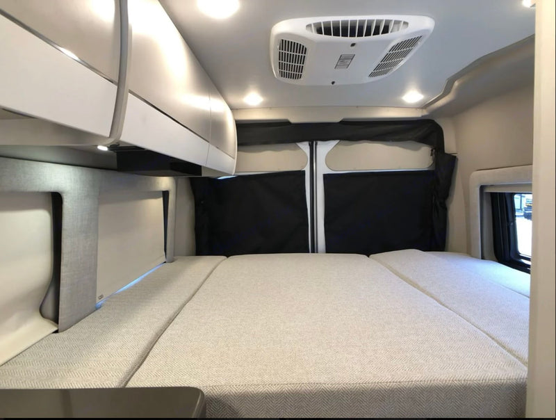  and cargo space. Perfect for adventure!|RV rental interior: Ram ProMaster driver's area with cream quilted seat — photo 7