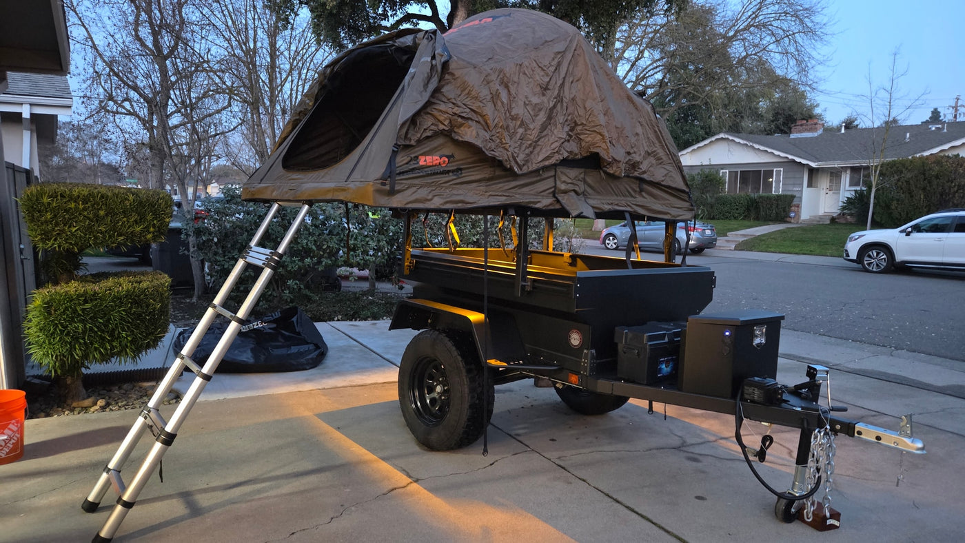Deployed rooftop tent on an overland trailer, ready for adventure! An excellent RV rental alternative for camping trips. — photo 7