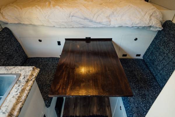  and decor.|Rear view of an RV rental camper van with open doors — photo 7