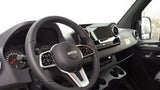 Freightliner van interior for rv rental, highlighting the dashboard, steering wheel, and infotainment display.