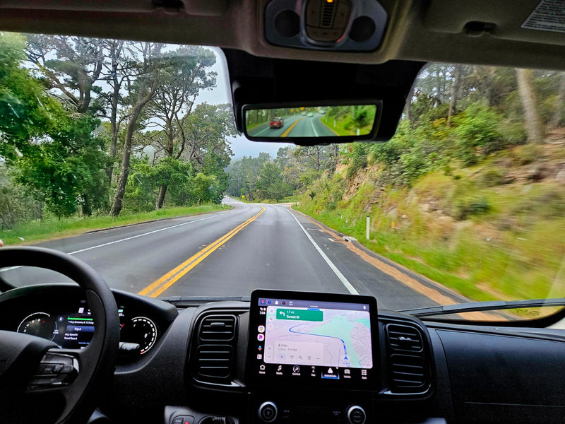  and window. Ideal for mobile living.|Cozy RV rental interior with two beds facing a stunning twilight mountain view — photo 12