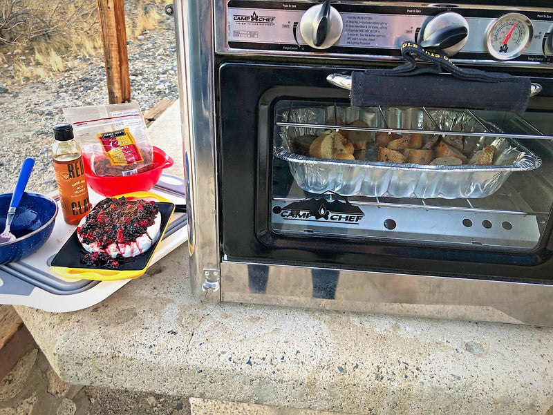  and an outdoor oven by the scenic coast.|Two young women enjoy an rv rental adventure from their camper van's rooftop tent — photo 24