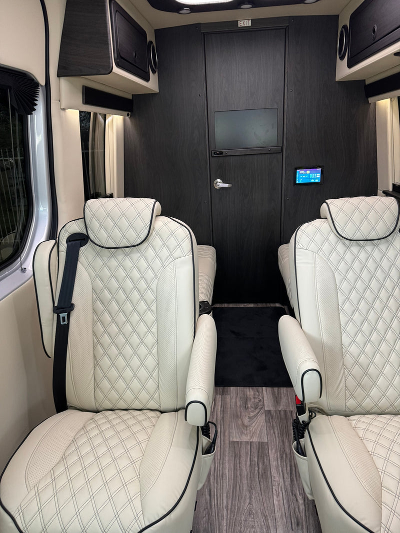  quilted front seats.|Plush rv rental interior with white quilted leather seats — photo 13
