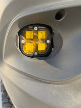 Close-up: Amber Baja Designs off-road fog light on a vehicle bumper. Ideal for your next RV rental adventure.