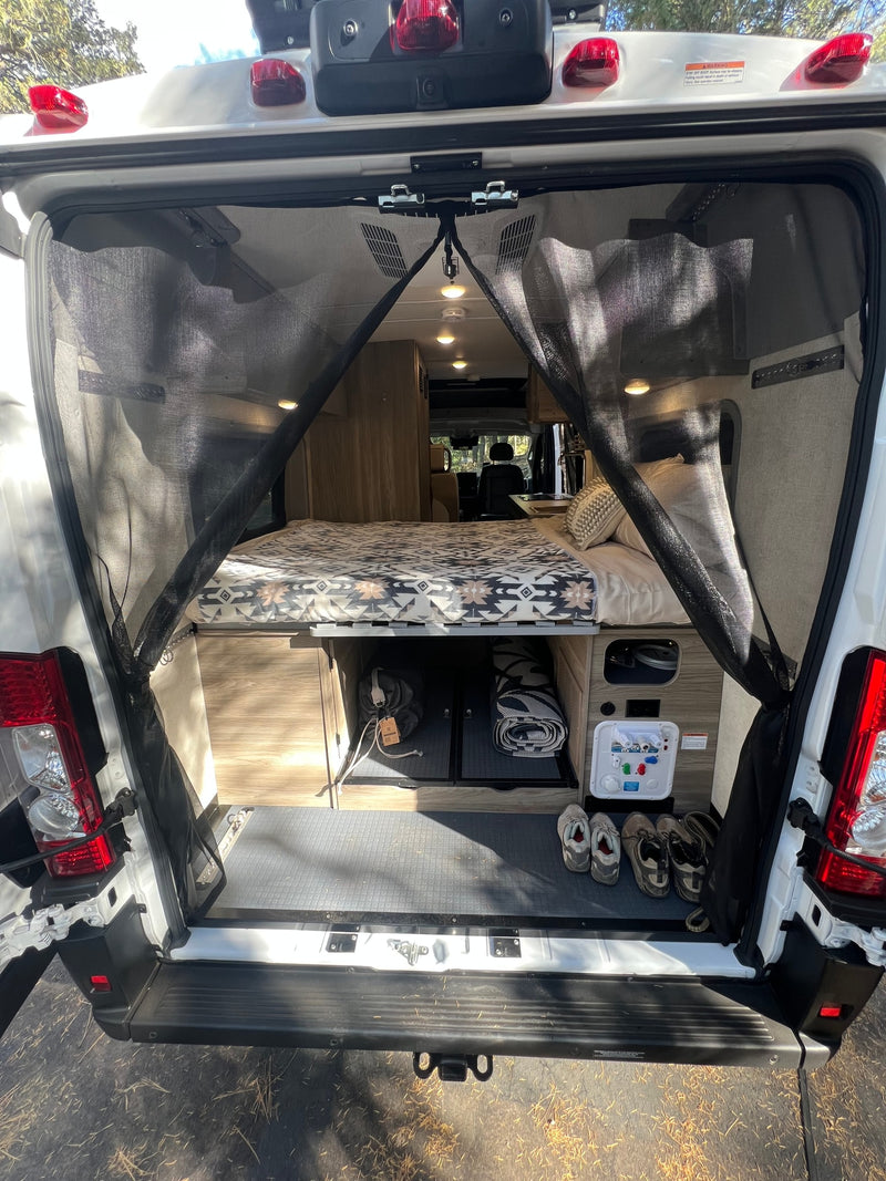  & desert scenery.|Experience freedom! This RV rental van's open rear reveals a spacious — photo 12