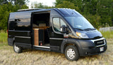 Black Ram ProMaster campervan with open side door, showcasing its converted interior. Ideal RV rental for outdoor adventures.
