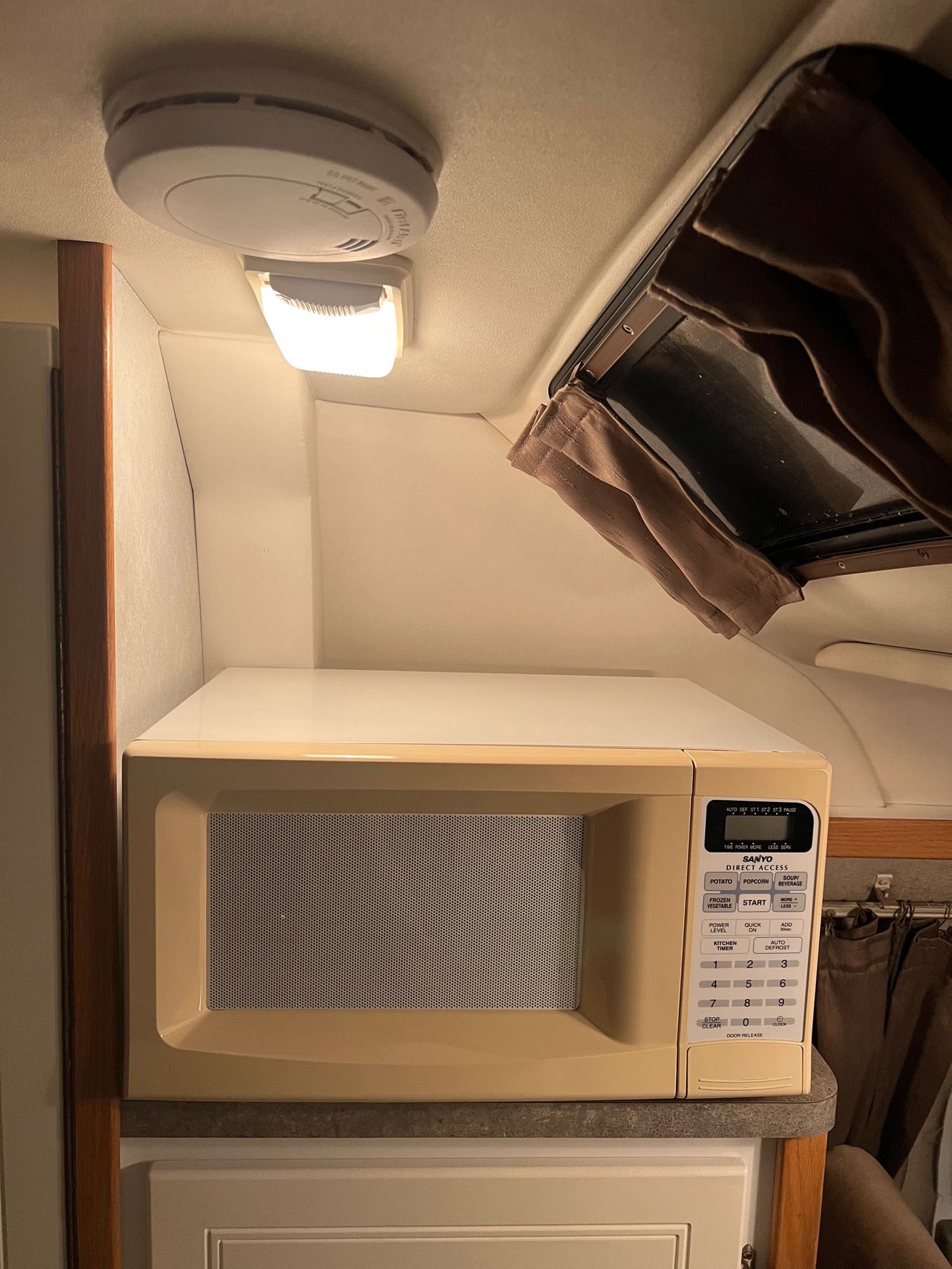  leading to the driver's area.|Rear view of an open Pleasure-Way RV rental — photo 12