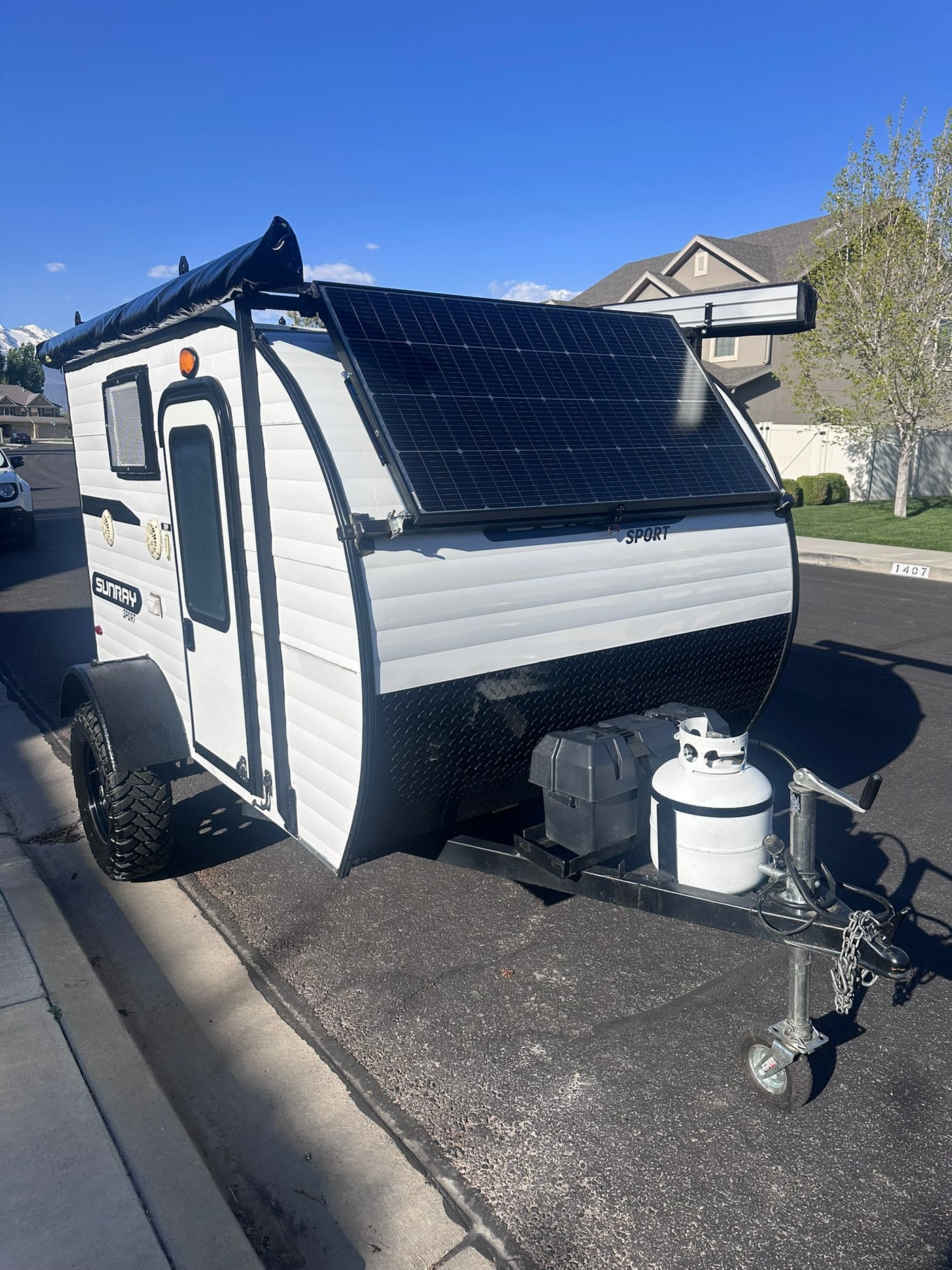 Compact Sunray Sport teardrop camper for RV rental. Ideal for outdoor travel and camping adventures.