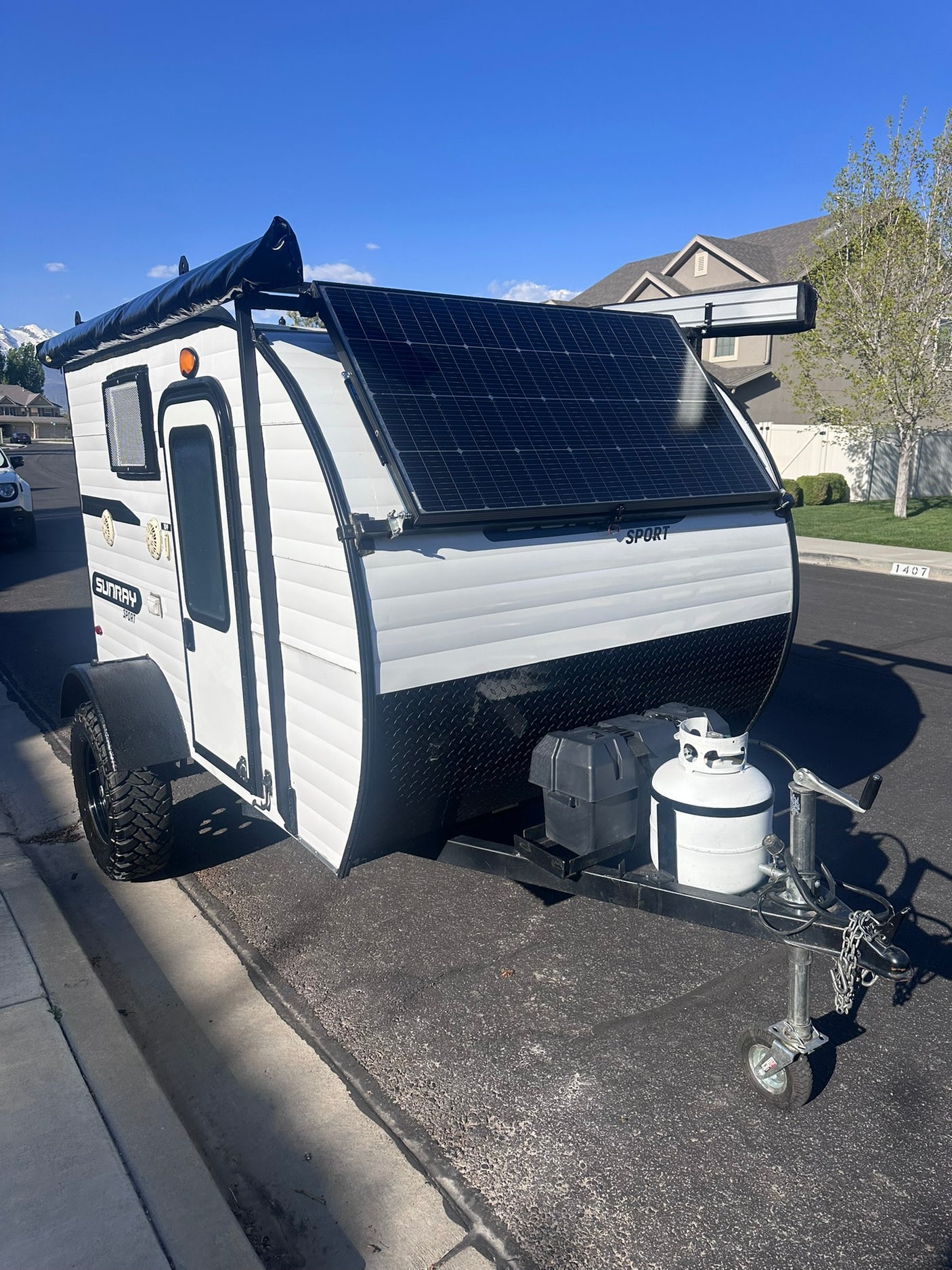 Compact Sunray Sport teardrop camper for RV rental. Ideal for outdoor travel and camping adventures.