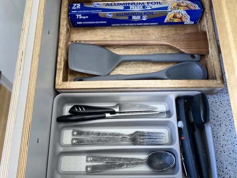RV rental kitchen drawer with neatly arranged cooking tools, cutlery, and foil, ready for your adventures. — photo 4
