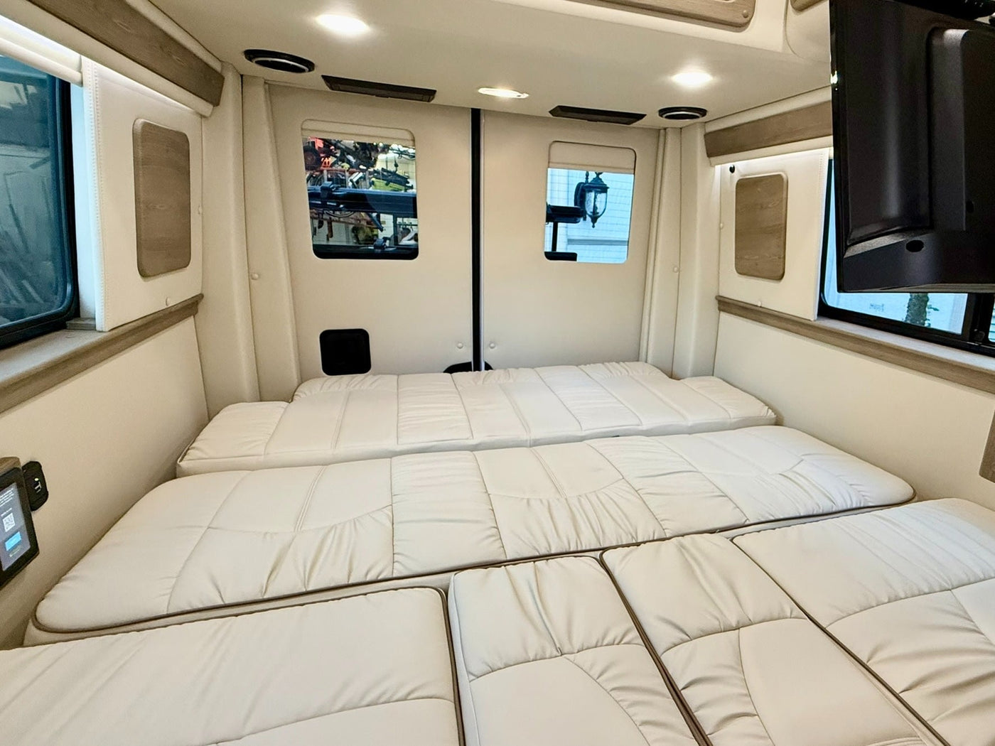  and a cozy blanket for travel comfort.|White Mercedes Sprinter rv rental with two bikes on a rear rack — photo 10