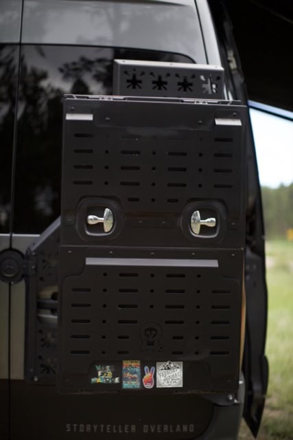  parked in a scenic outdoor setting. Ideal for an RV rental.|Explore the outdoors with this Storyteller Overland RV rental. Equipped with rooftop AC — photo 9