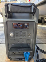 Portable power station charging an RV rental, displaying 30% battery remaining and 1635W output for connected devices.