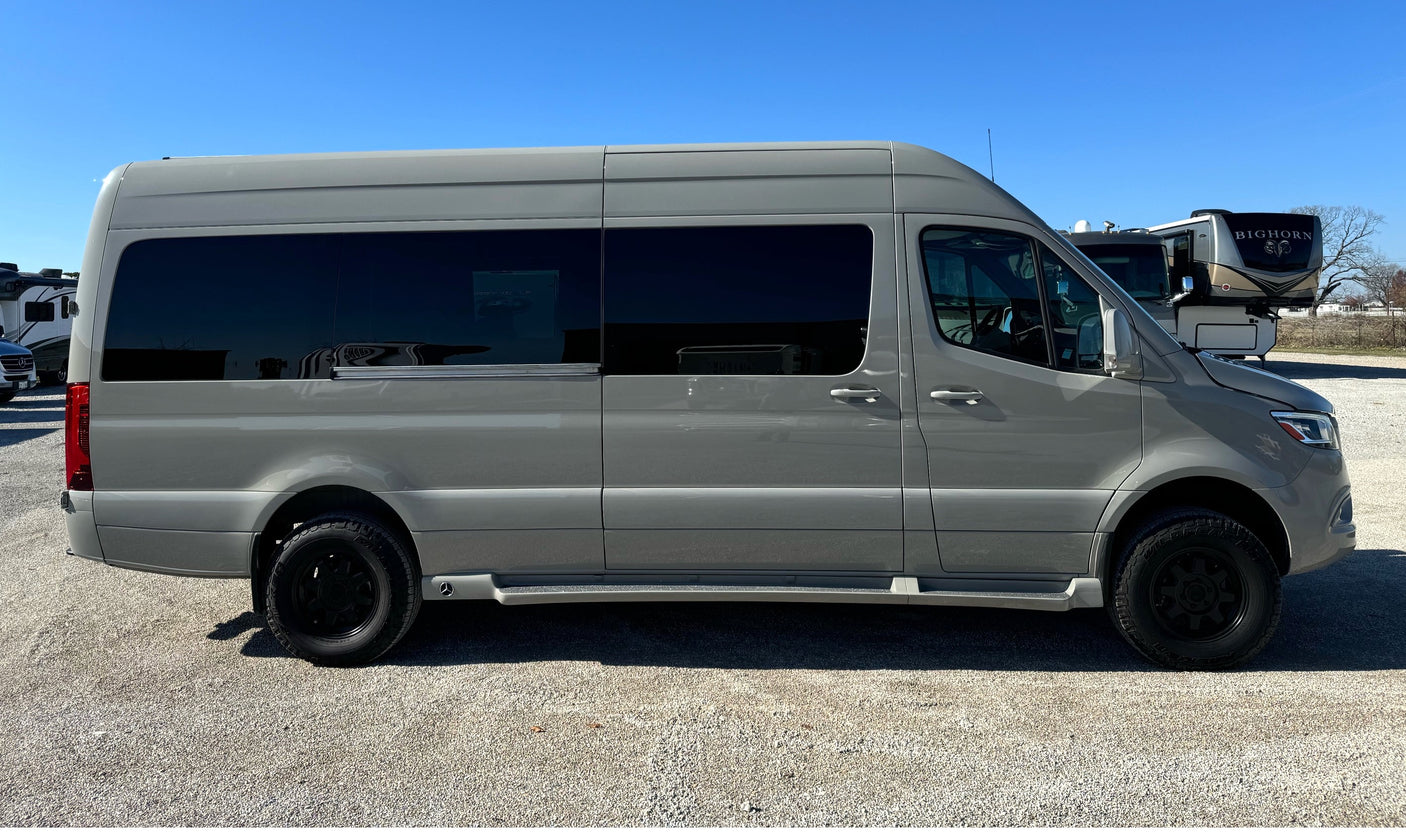 Side view of a modern gray Mercedes-Benz Sprinter camper van, ready for your next rv rental adventure.