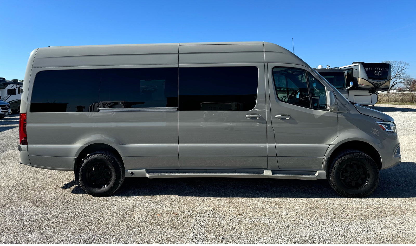 Side view of a modern gray Mercedes-Benz Sprinter camper van, ready for your next rv rental adventure.