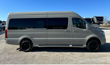 Side view of a modern gray Mercedes-Benz Sprinter camper van, ready for your next rv rental adventure.