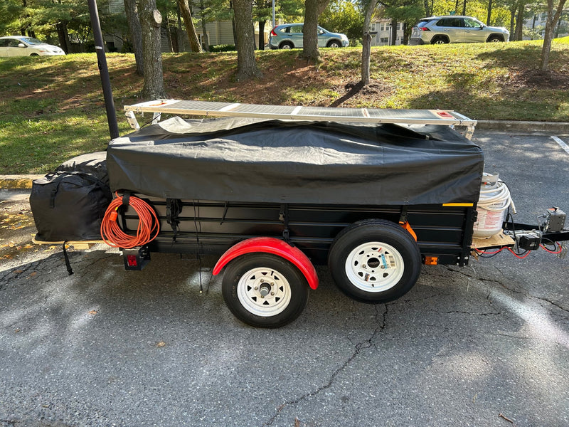 Custom DIY camping trailer with solar panels and gear — photo 1