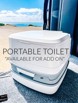 Portable toilet for your RV rental, an essential add-on for comfortable camping with ocean views.